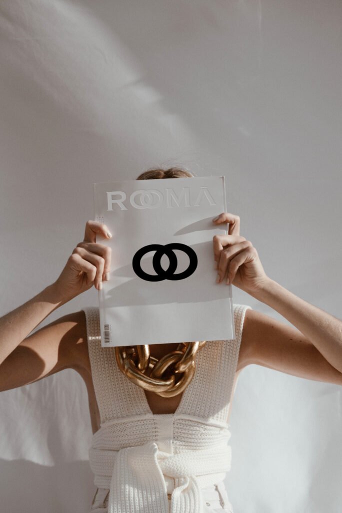 Italian clothing brand logo for Rooma featuring custom typography inspired by Roman architecture and timeless Italian craftsmanship, designed for a refined and contemporary fashion identity.