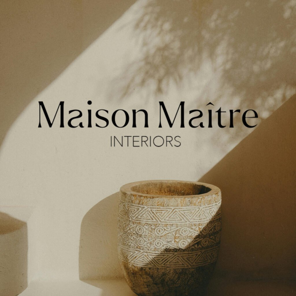 Luxury interior design logo for Maison Maître featuring a minimalist maison de maître illustration and custom-designed typography, created for a refined and timeless brand identity.