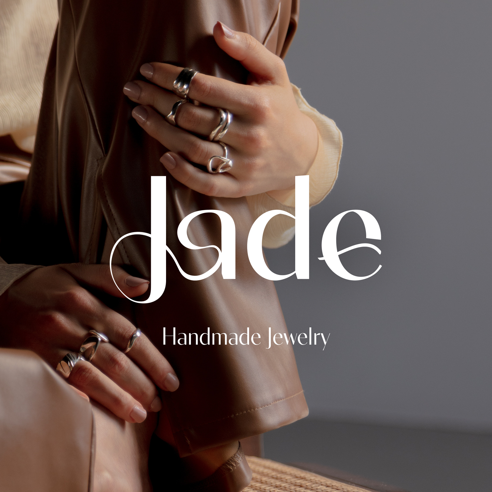 Feminine jewelry logo design for Jade, a handmade jewelry brand, featuring soft curves inspired by ring shapes and the natural lines of women’s bodies, expressing craftsmanship, elegance, and empowerment.