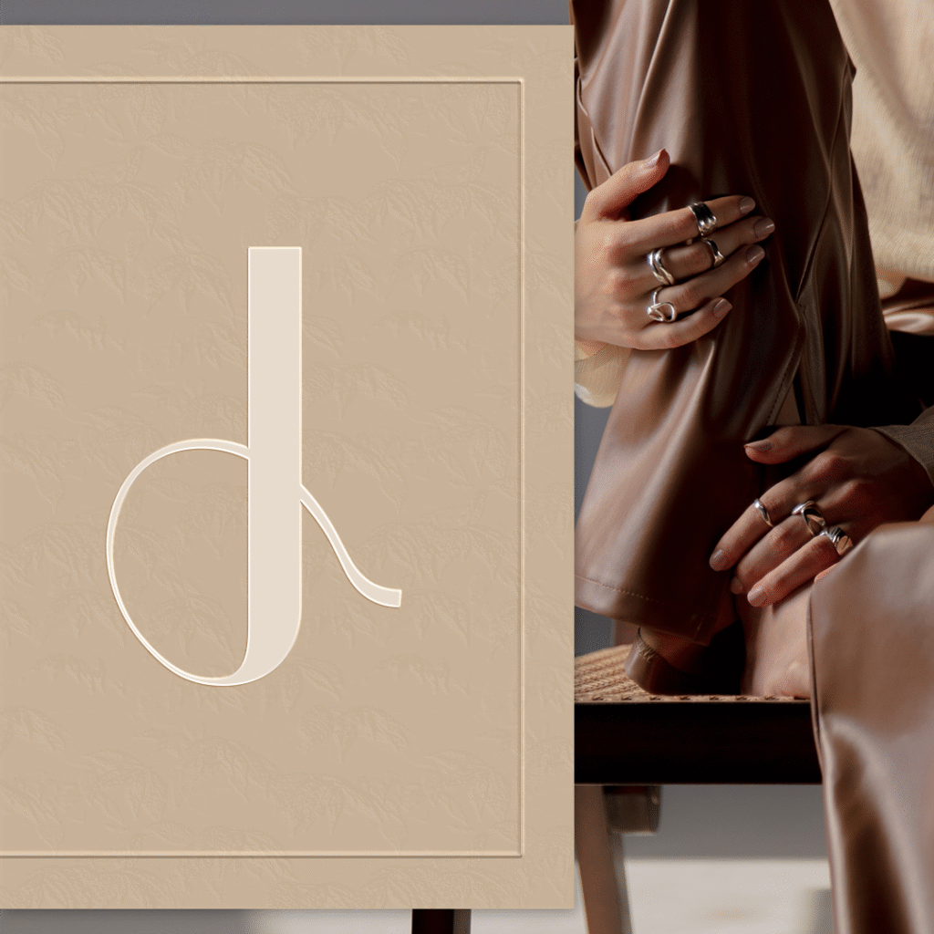 Feminine jewelry logo design for Jade, a handmade jewelry brand, featuring soft curves inspired by ring shapes and the natural lines of women’s bodies, expressing craftsmanship, elegance, and empowerment.